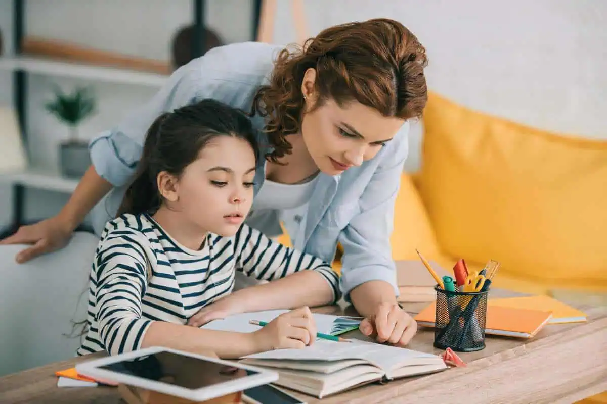 An image of a parent and child working together at a table, showcasing personalized instruction.