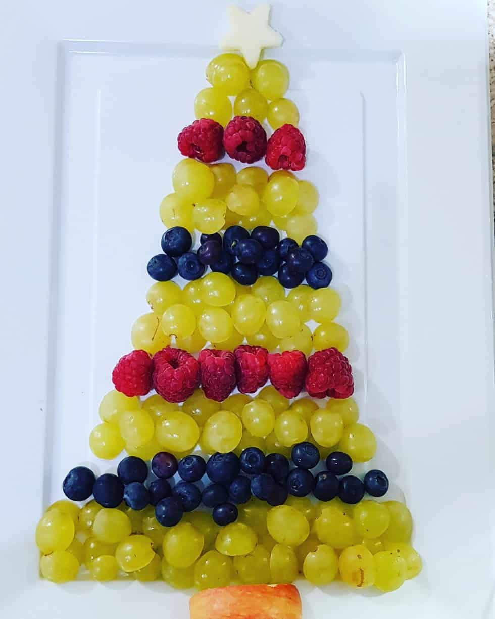 Fruit Christmas Tree Food Platter with grapes, blueberries, raspberries, and apple 