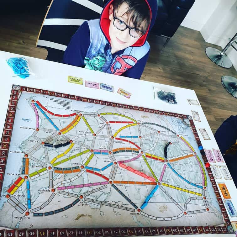 9 year old boy playing Ticket to Ride North America