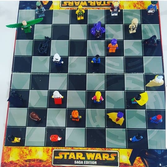 Lego minifigures on a Star Wars draughts board