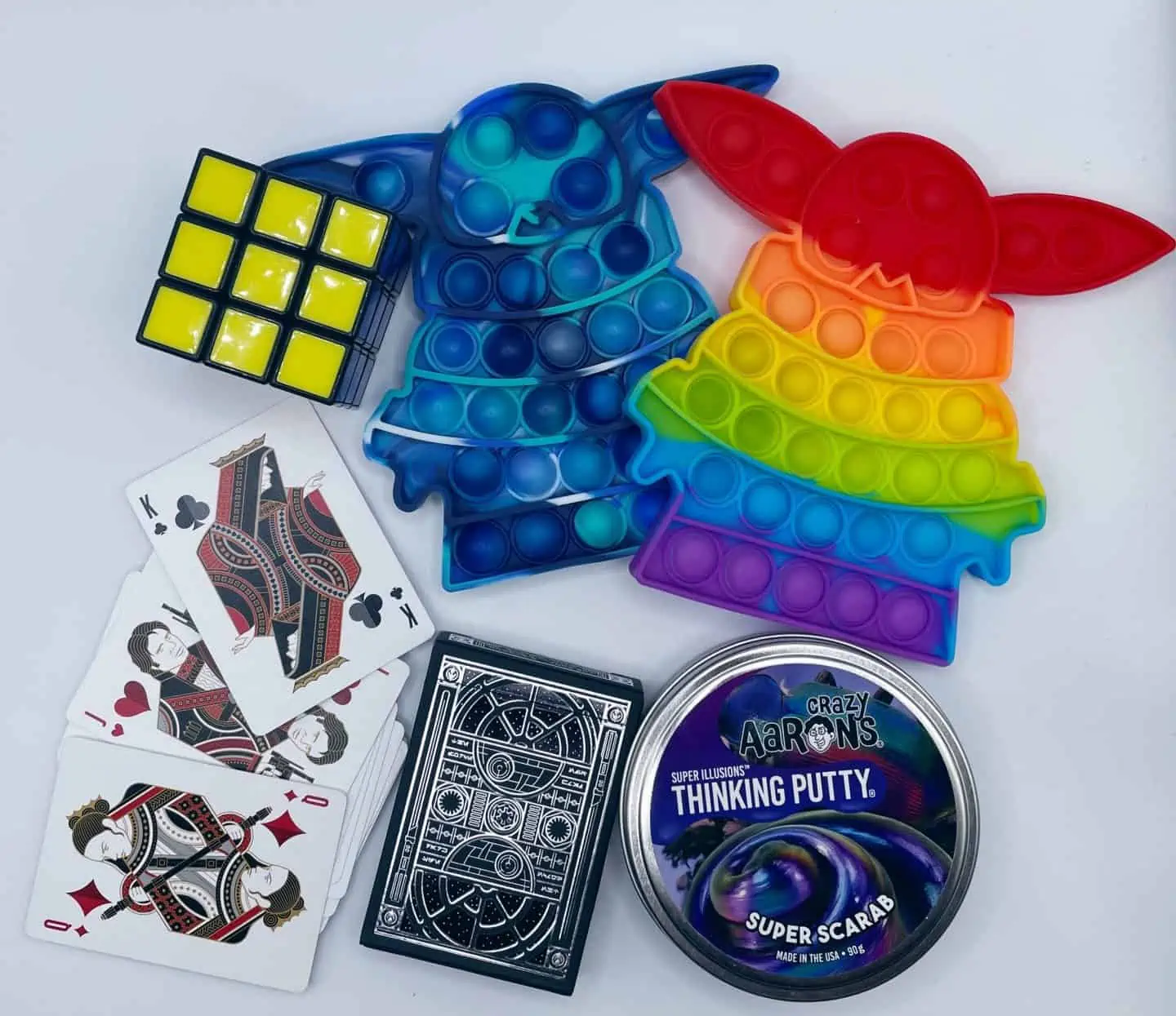 stocking stuffers: pop its, playing cards, thinking putty, and rubix cube