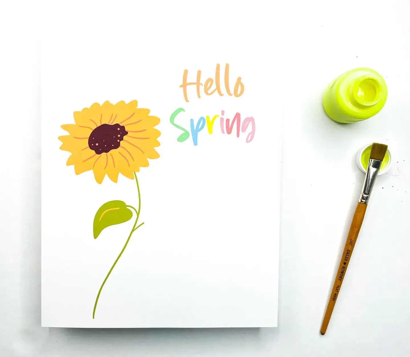 A handprint art printable with the words "Hello Spring" next to a yellow sunflower, accompanied by a paintbrush and an open pot of yellow paint.

