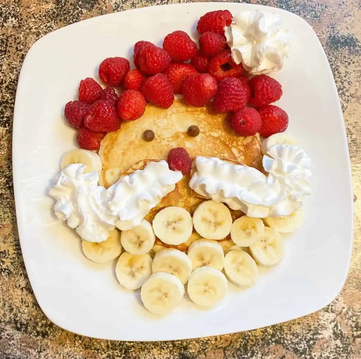 Easy-Santa-Pancakes-for-Christmas-breakfast-with-whipped-cream