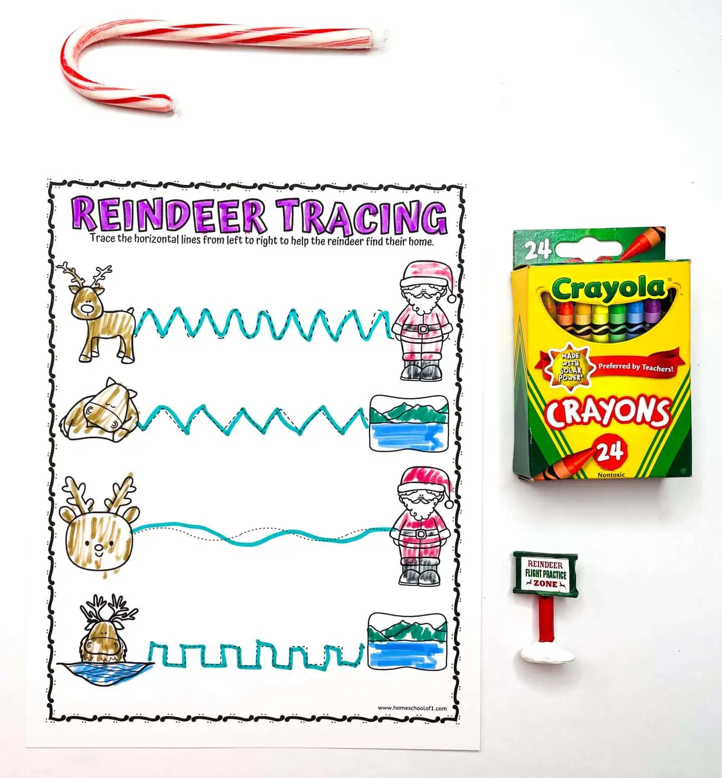 reindeer tracing worksheet with 4 reindeers trying to get to santa