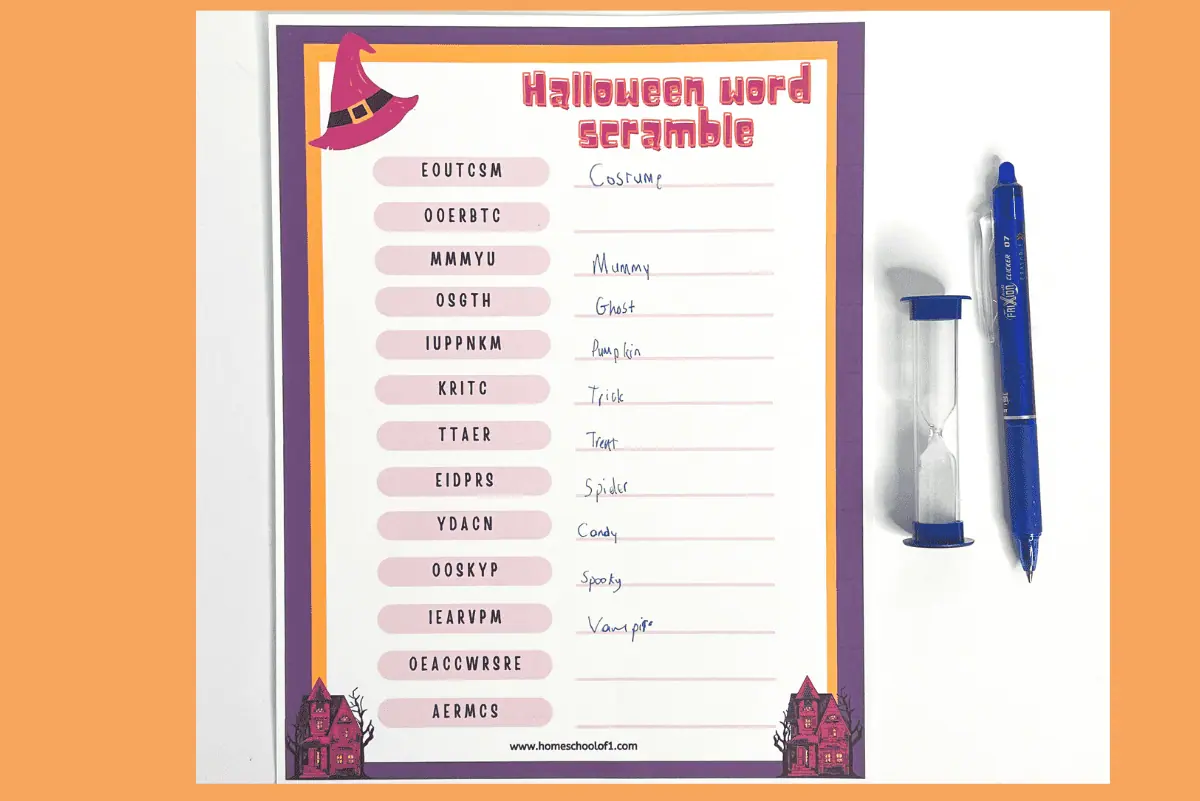 completed halloween word scramble worksheet with a sand timer and a pen