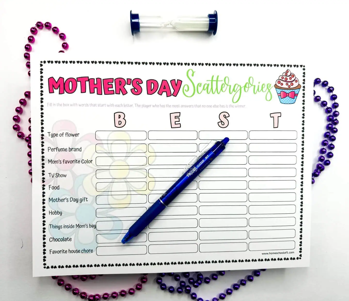 Mother's Day Scattergories printable with the word 'BEST' spelled out. Surrounded by a blue pen and magenta beads, the sheet prompts creative answers for categories like 'Perfume brand' and 'Hobby'.