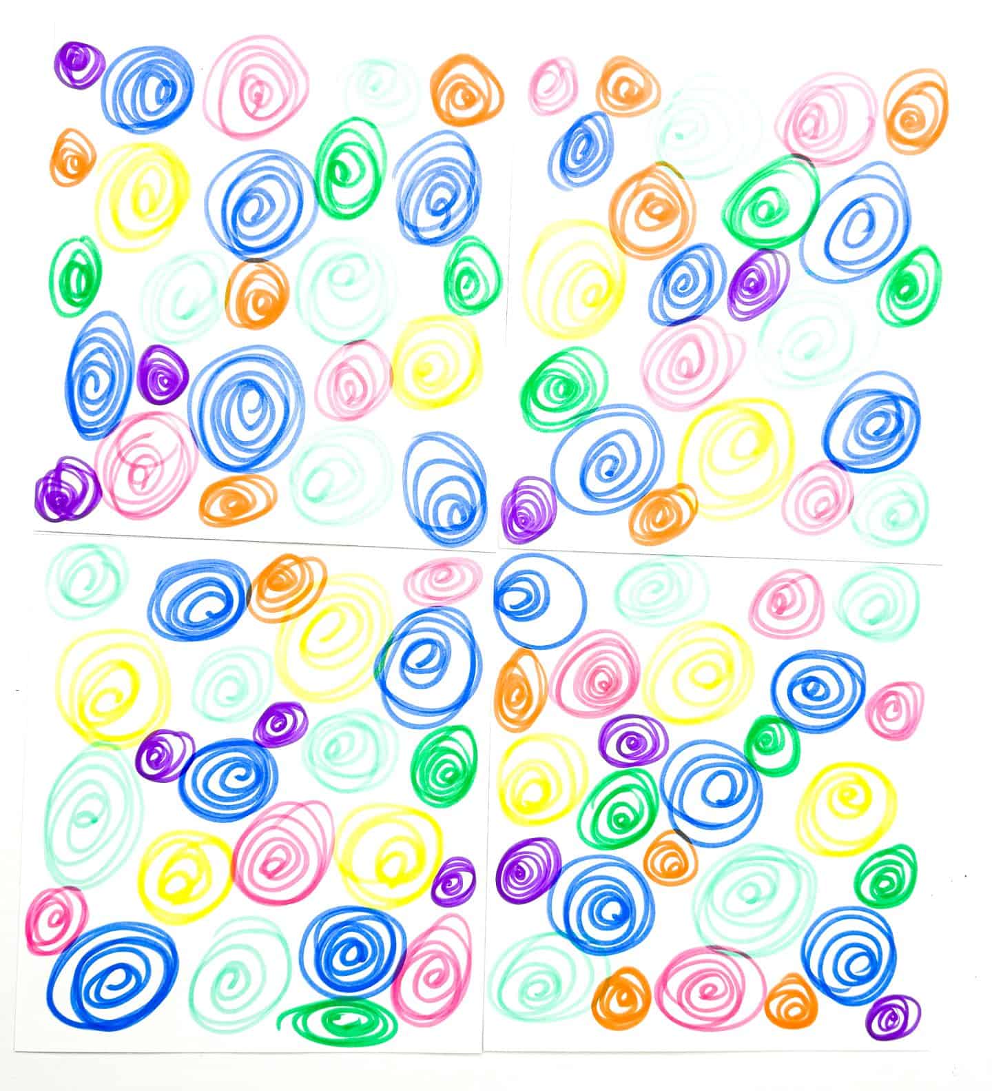 Blank sides of 'Clothing Memory Game' cards revealed, showing a colorful swirl pattern in various colors, hinting at the memory challenge when turned over.