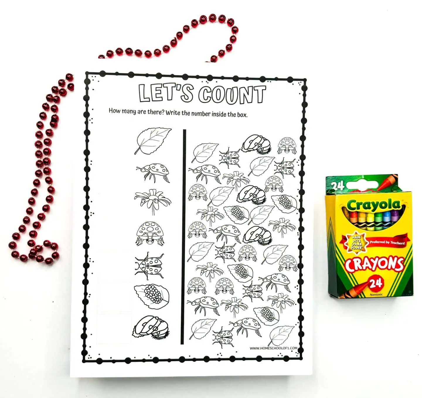 Interactive 'Let's Count' worksheet showcasing various outlined insects and leaves for kids to count and write numbers in adjacent boxes, with red beads and a box of crayons presented alongside.