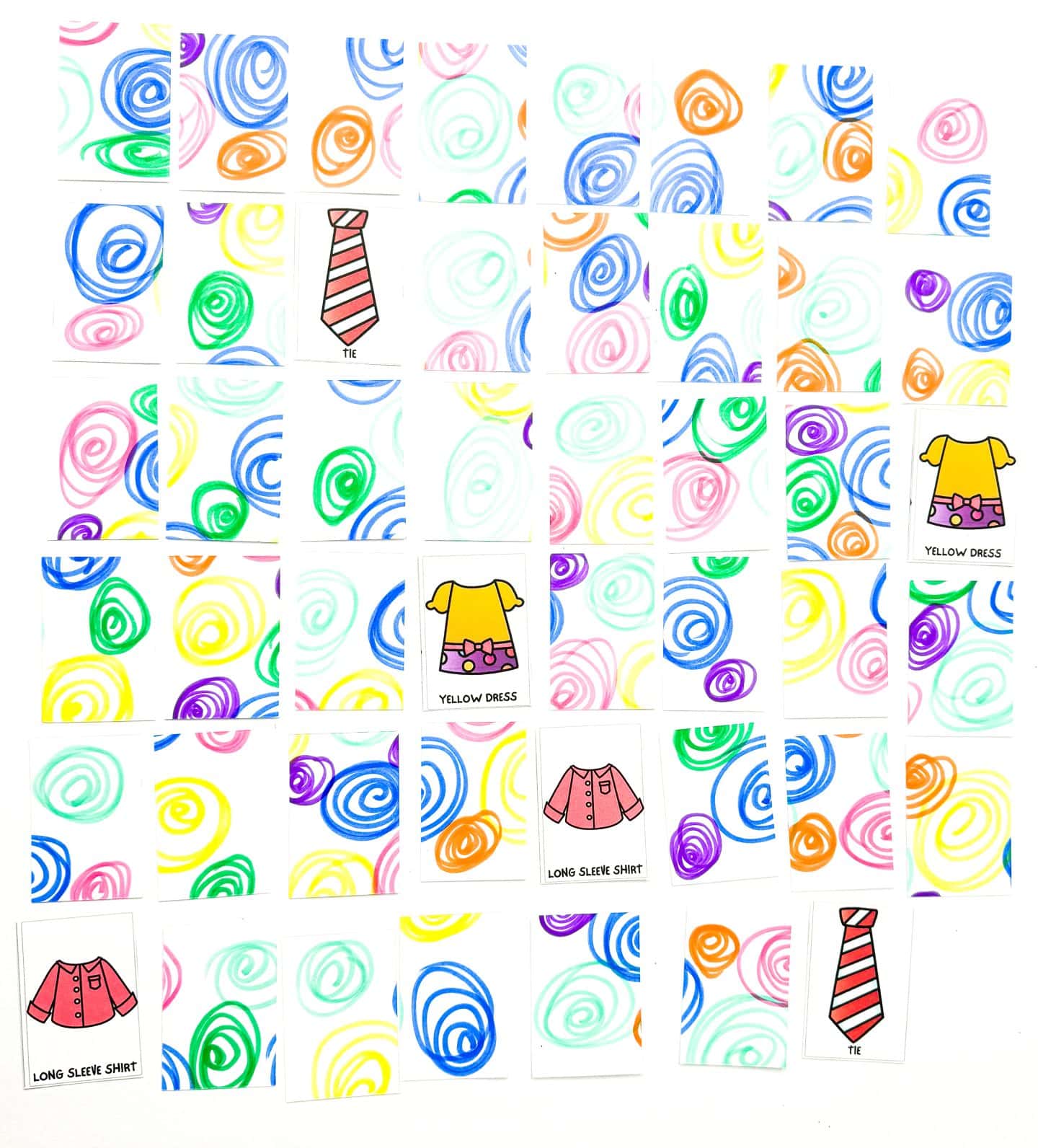 Array of 'Clothes Memory Game' cards laid out for play, with colorful swirl patterns on the back and visible clothing items including a tie and yellow dress facing up, on a white background."