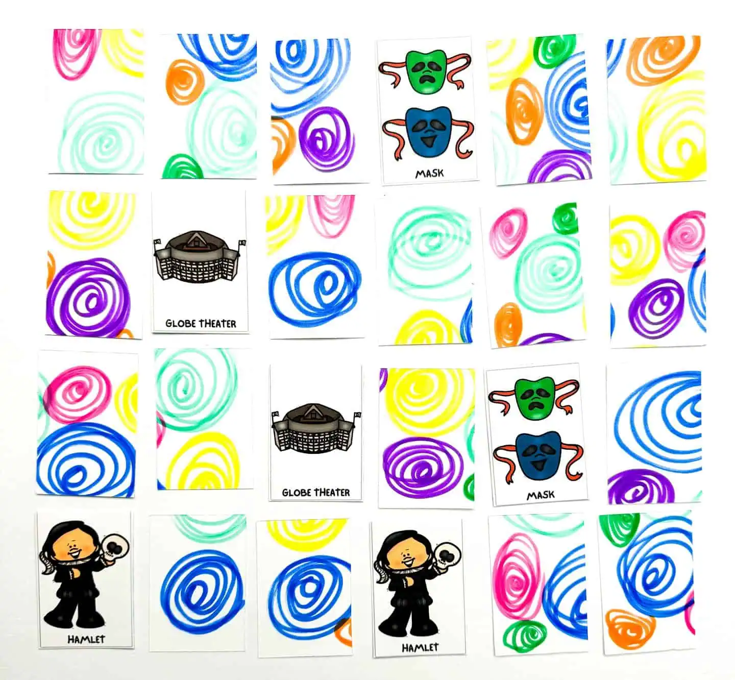 Part of a 'Shakespeare Memory Game' in progress, with cards showing colorful swirl patterns on one side and illustrations of a mask, Globe Theater, and Hamlet on the other.