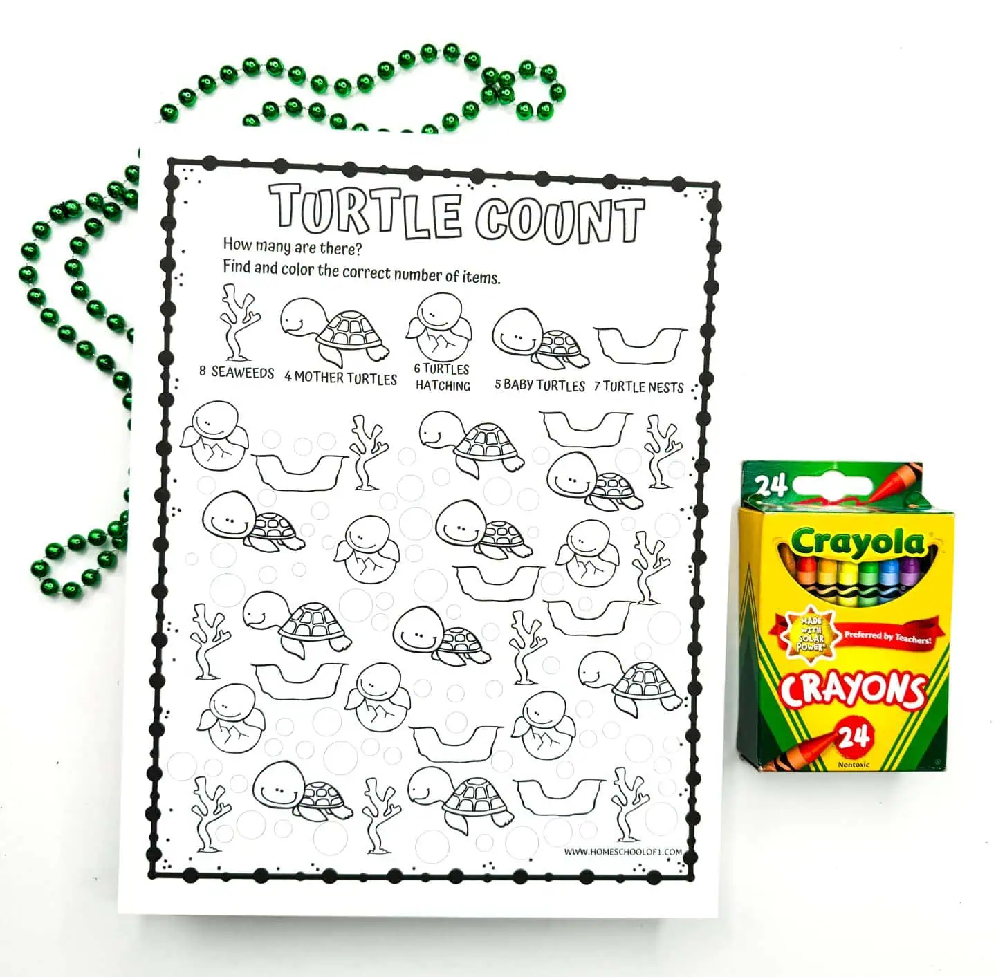 Interactive worksheet called 'TURTLE COUNT' asks children to identify and color the correct number of seaweeds, mother turtles, turtles hatching, baby turtles, and turtle nests. Accompanied by a box of crayons and strands of beads.